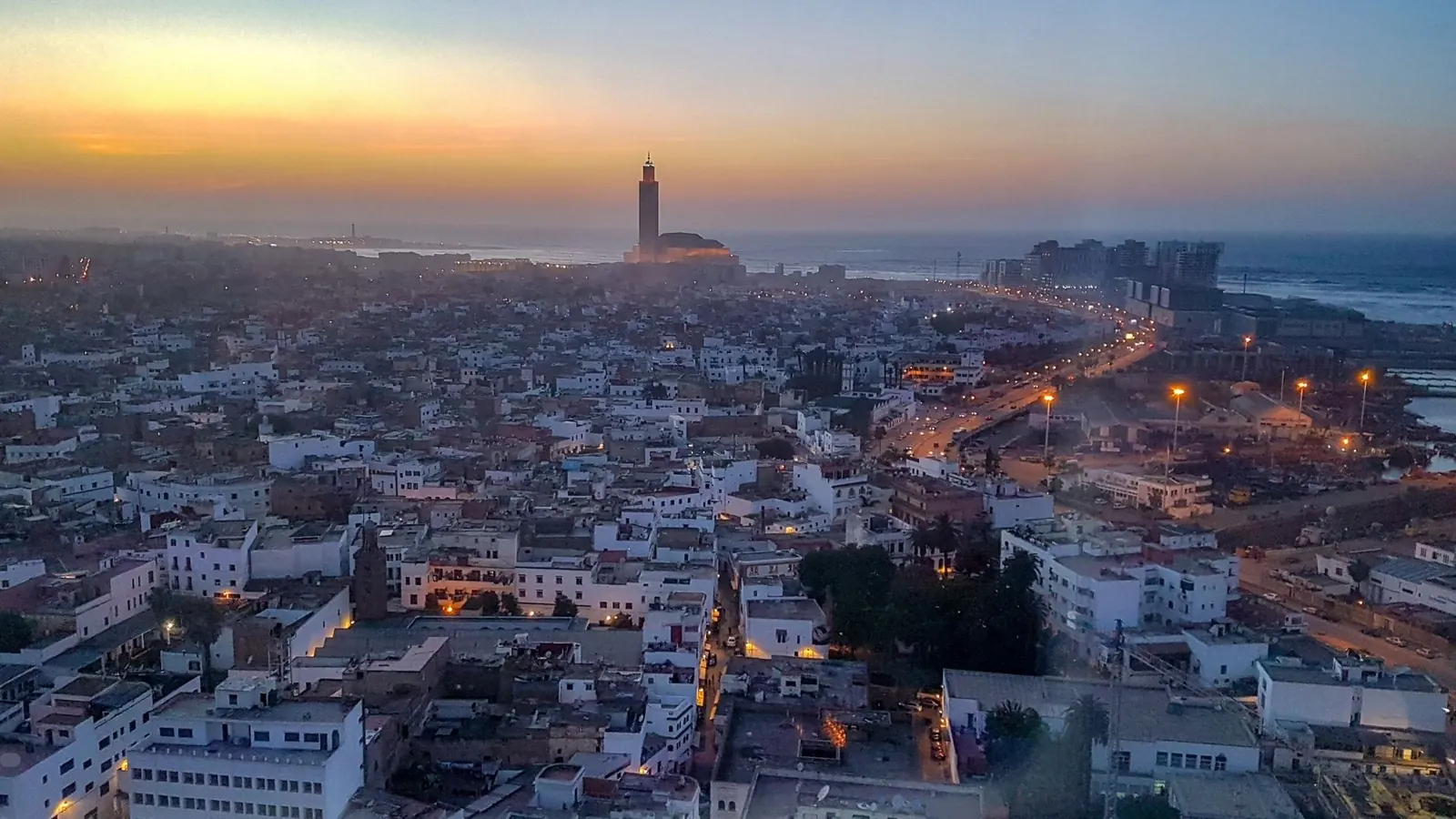 View of Casablanca at sunset with the Hassan II Mosque
