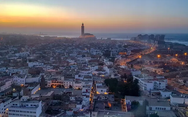 View of Casablanca at sunset with the Hassan II Mosque
